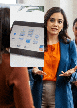 A woman presents to a group in a modern office setting, engaging them in a new website project design discussion.